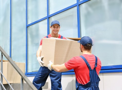 Man with van loading items for a move in Lamorbey