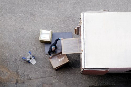 Business relocation team organising desks and IT equipment