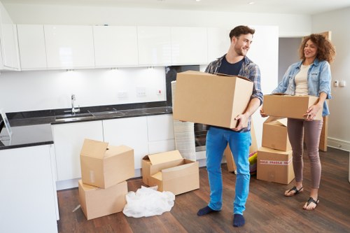 Loading boxes and household items into a van for a Lamorbey move