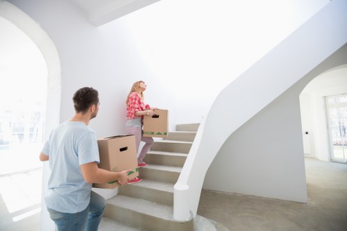 Careful handling of bulky household items during a van collection