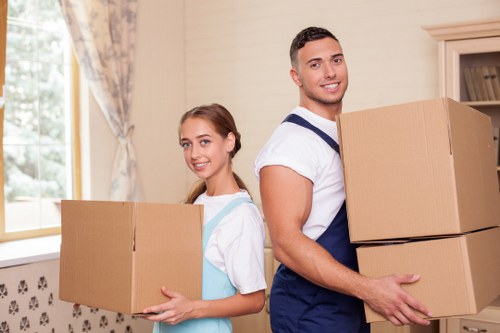 Furniture and boxes being transported by a local moving van